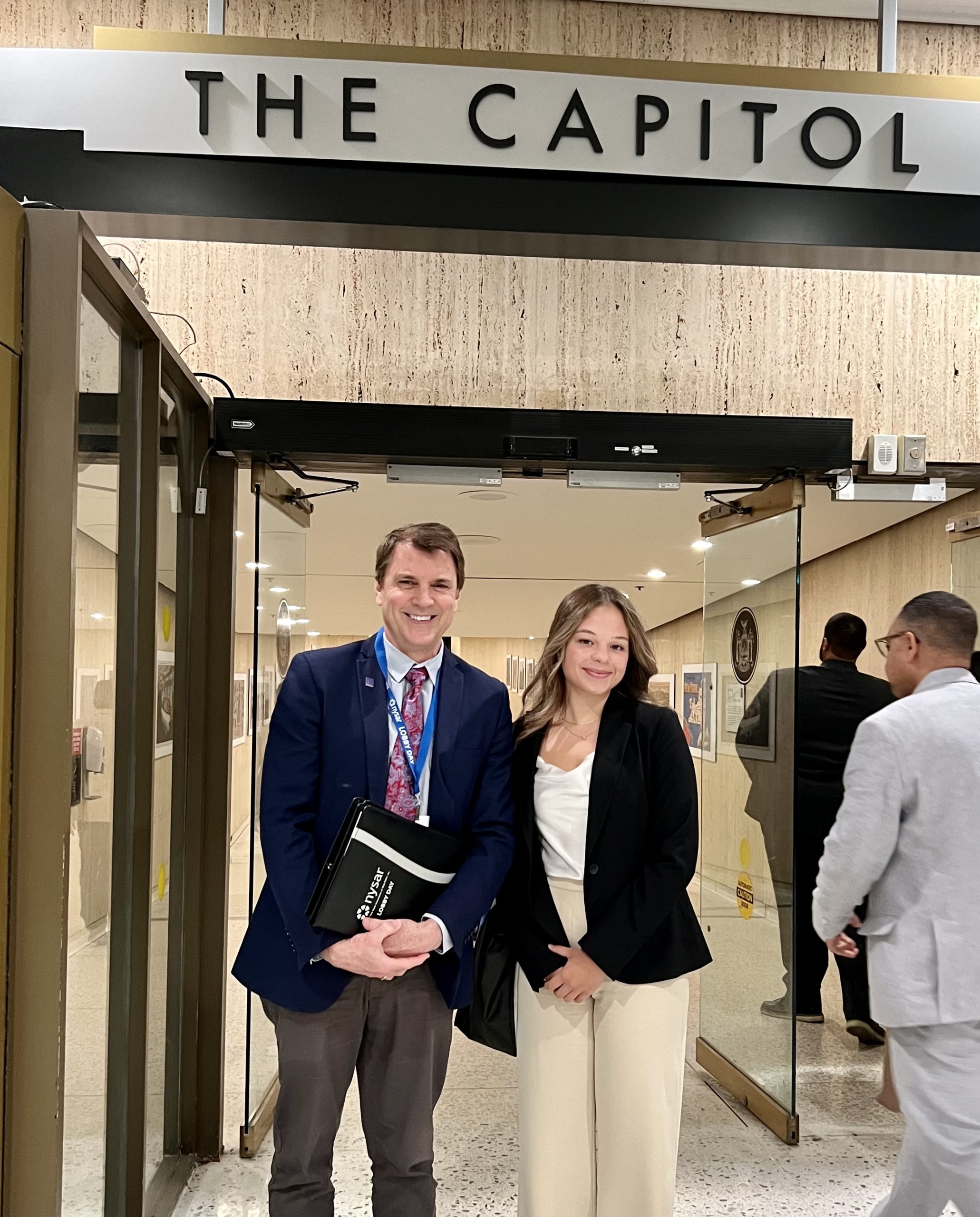 Better Homes and Gardens Real Estate Choice Realty Principal Broker John Crittenden with Spring 2022 Intern Julia DaCosta at NYS Lobby Day 2022